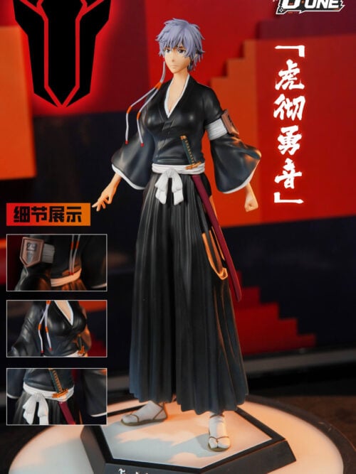 Isane Kotetsu statue in black robes with a white sash and sheathed sword on a name-labelled base, with three detail insets.