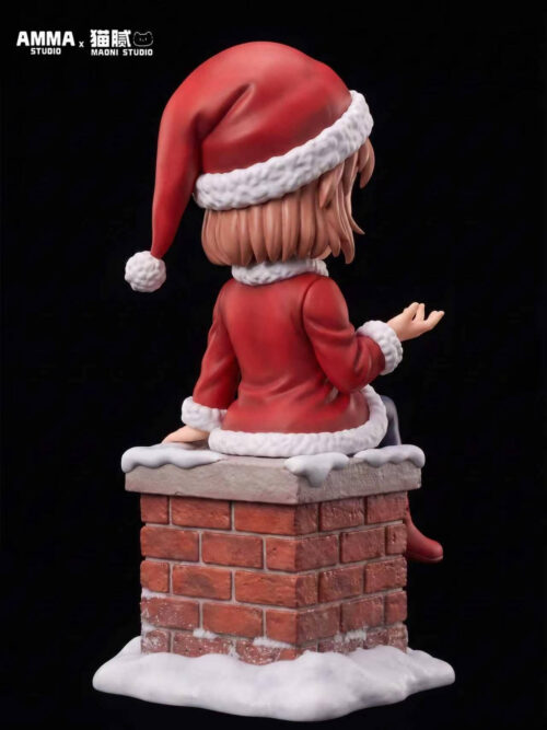 Rear three-quarter view of Ai Haibara showing her Santa hat, short brown hair and white-trimmed red coat above the snowy brick chimney base.