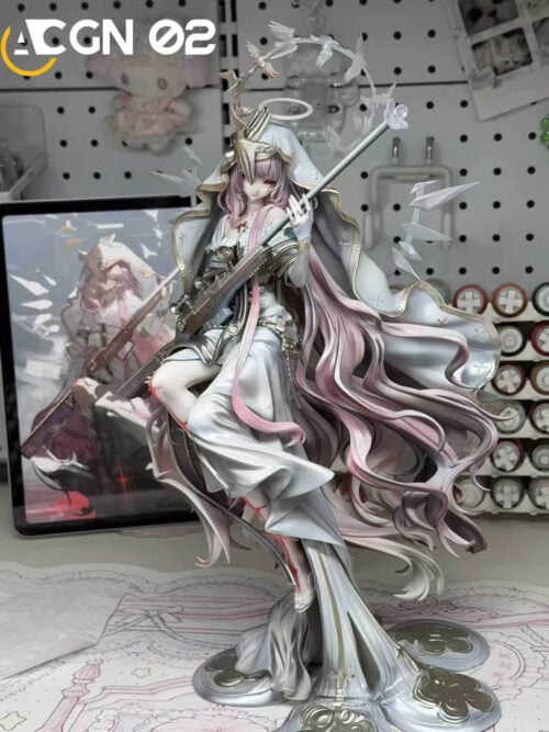 Lemuen statue displayed on a workbench, holding a scoped rifle beneath a white hood and bird-shaped ring, with long pink hair sweeping outward.