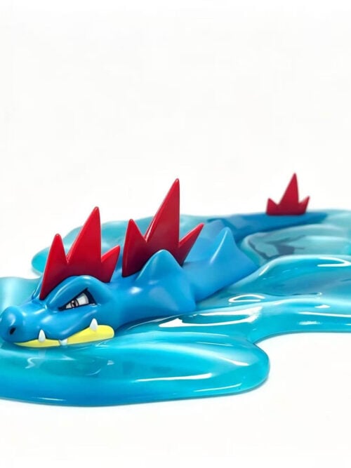 Blue Feraligatr with red crests in a low swimming pose, surrounded by a glossy turquoise water-wave base.