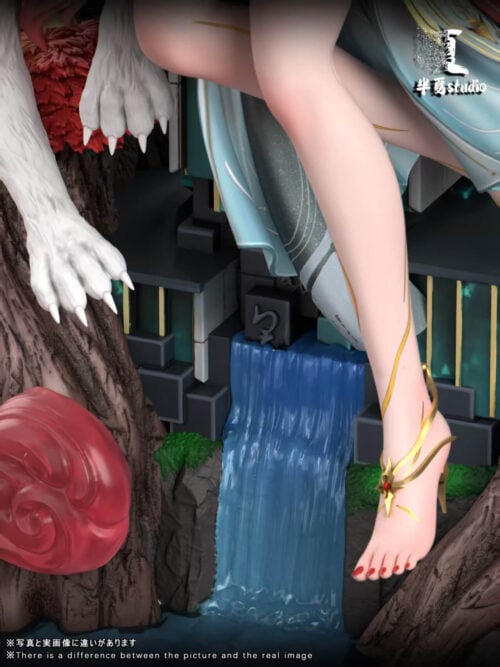 Close-up of the blue waterfall, teal architectural base, white fox paws and Hsin's gold-colored ankle ornament.