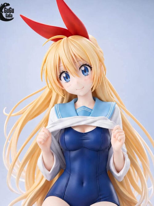 Front close-up of Chitoge Kirisaki with blue eyes, blonde hair, a red ribbon, a pale blue sailor collar and a navy swimsuit.