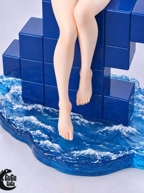 Close-up of blue tiled steps and sculpted water with white wave crests beneath Chitoge Kirisaki's dangling feet.