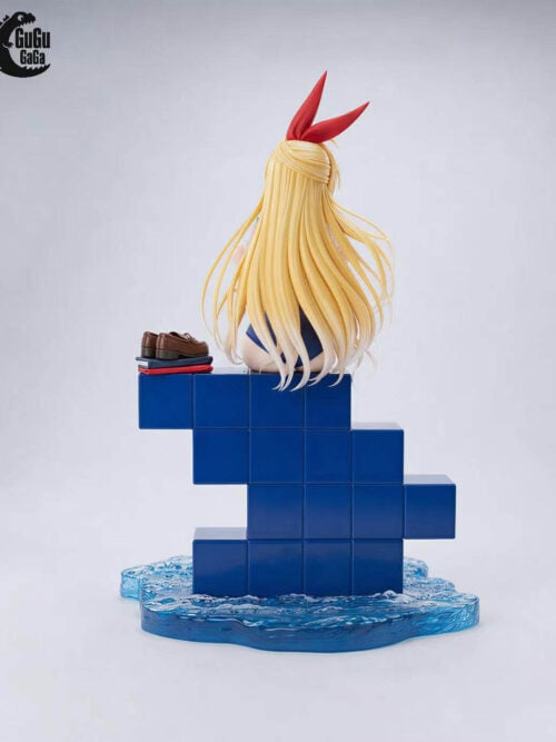 Rear view of Chitoge Kirisaki showing long blonde hair, brown loafers on folded clothing, blue tiled steps and the water base.