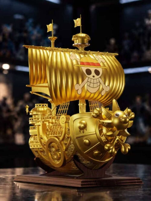 Gold Version Thousand Sunny viewed from the number 3 side, showing the lion figurehead, billowing sails and brown display stand.