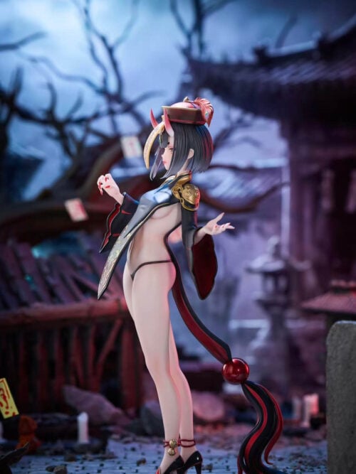 Side view of Shuten Doji showing her short bob, curved hanging talisman, bell-trimmed heels and long trailing costume ornament.