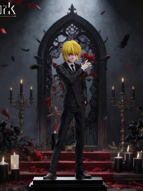Kurapika in a black double-breasted suit, raising a chain-covered hand while standing on a stepped rectangular base against a gothic backdrop.