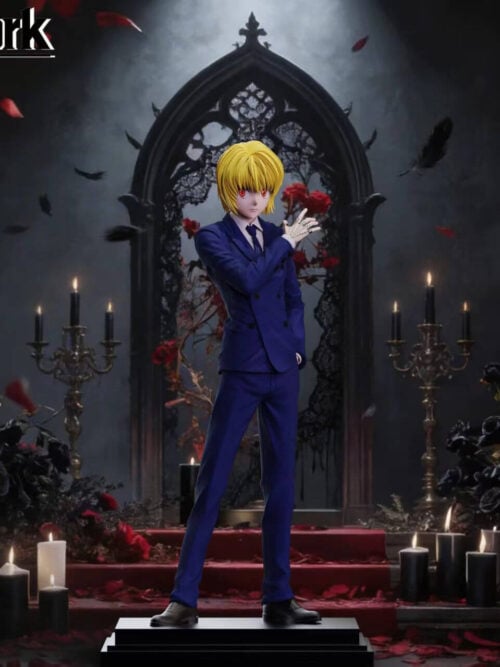 Kurapika in a blue double-breasted suit, with blond hair, red eyes and a raised chain-covered hand, standing on a stepped rectangular base.