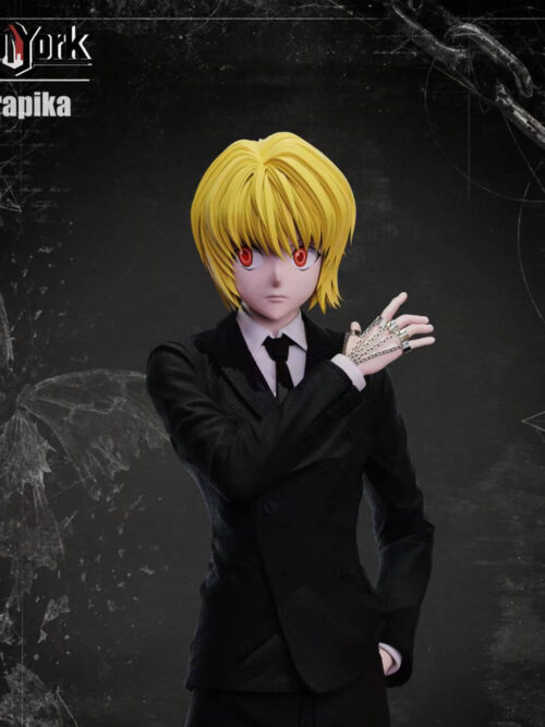 Front upper-body view of Kurapika in a black double-breasted suit, with red eyes, a raised chain-covered right hand and his left hand in a pocket.