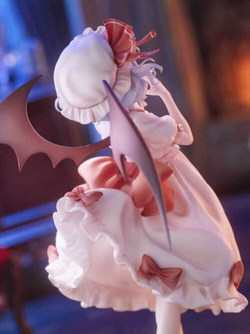 Rear three-quarter view of Remilia Scarlet showing her ruffled bonnet, broad bat wings and red bows on a pale dress.
