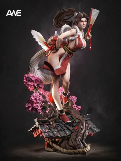 Three-quarter side view of Mai Shiranui leaning forward with two fans, a sweeping ponytail and white tassel above a flowering rooftop base.