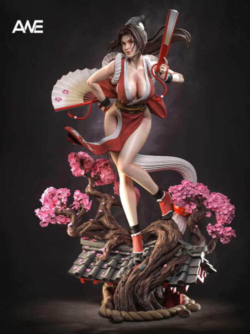 Angled front view of Mai Shiranui with a raised fan and an open floral fan, standing above twisting branches and a tiled rooftop.