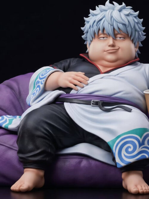 Front view of Gintoki Sakata reclining barefoot in a purple beanbag, wearing a white swirl-trimmed robe beside a cup and wooden sword.