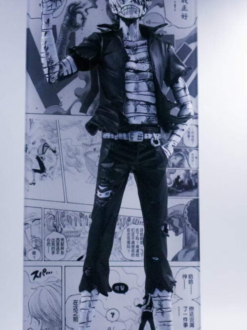 Angled full view of the monochrome Sanji figure with a raised cigarette hand, torn trousers and bandaged legs on a clear platform.