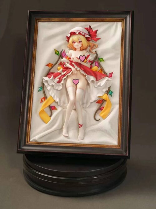 Censored photo of Flandre Scarlet's full framed display, showing colorful wing ornaments, yellow ribbons and a black circular platform.