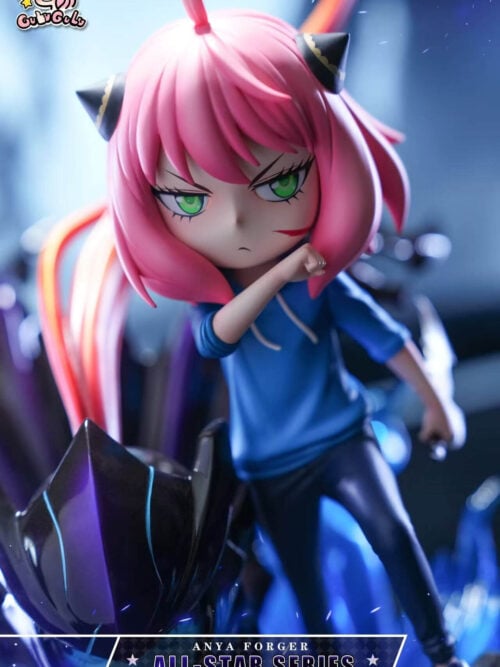 Pink-haired Anya with green eyes and a red cheek mark, raising one forearm across her blue hoodie.