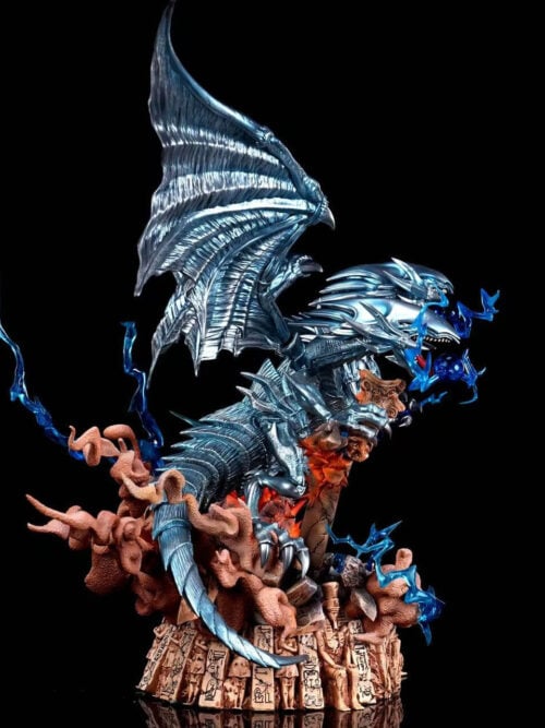 Side view of Blue-Eyes Ultimate Dragon with a raised wing, curving armored tail, broken columns and blue effects above a carved ruin base.
