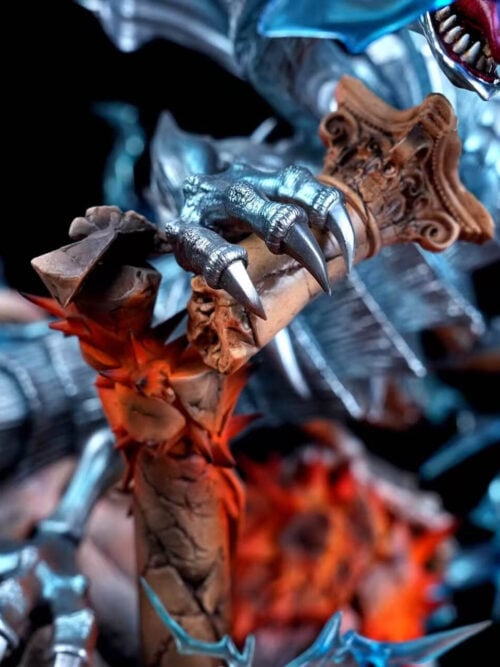 Detail of Blue-Eyes Ultimate Dragon's silver-blue claw gripping a broken carved column surrounded by orange impact effects.