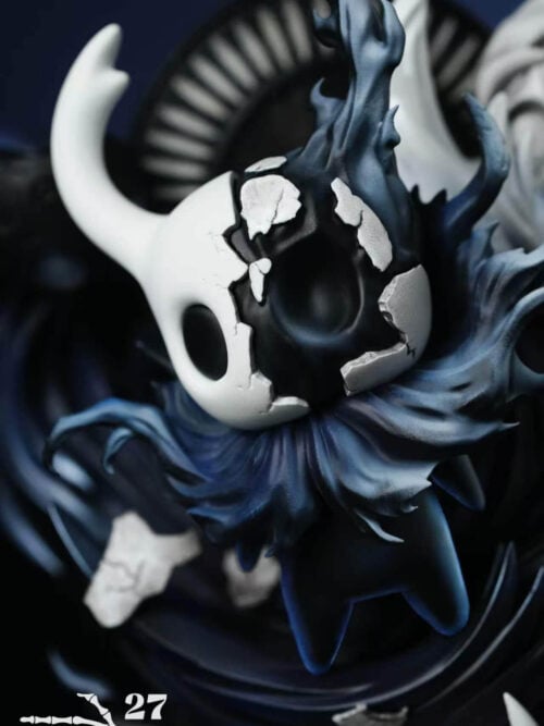 Close-up of the Knight's cracked white shell exposing a dark face, surrounded by blue-black curling forms.