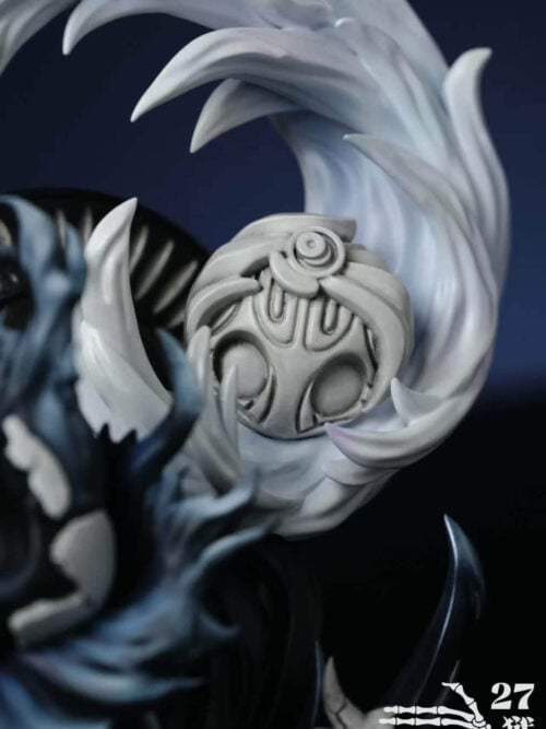 Close-up of a pale oval ornament with recessed patterns beneath the sweeping white effect beside the Knight's fractured shell.