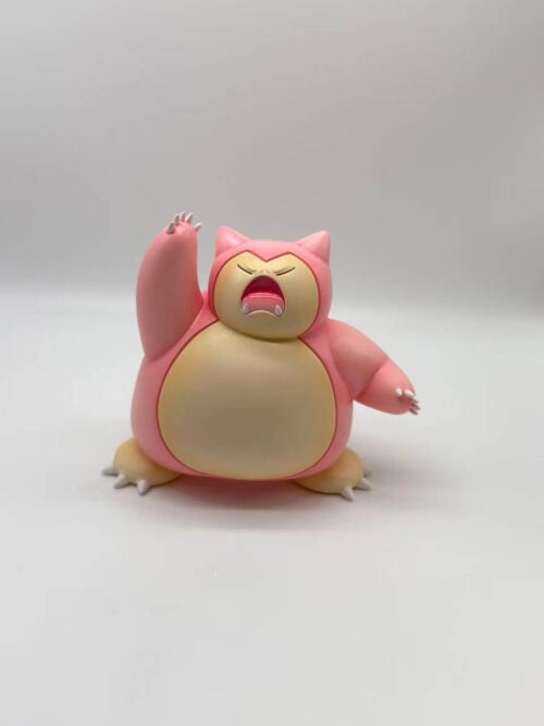 Pink Snorlax figure with a cream face and belly, one arm raised, closed eyes and an open mouth.