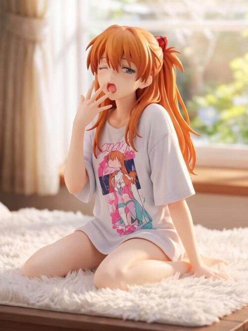 Asuka Langley Soryu figure seated with folded legs in a white graphic T-shirt, one hand raised to her mouth, on a white fluffy surface.