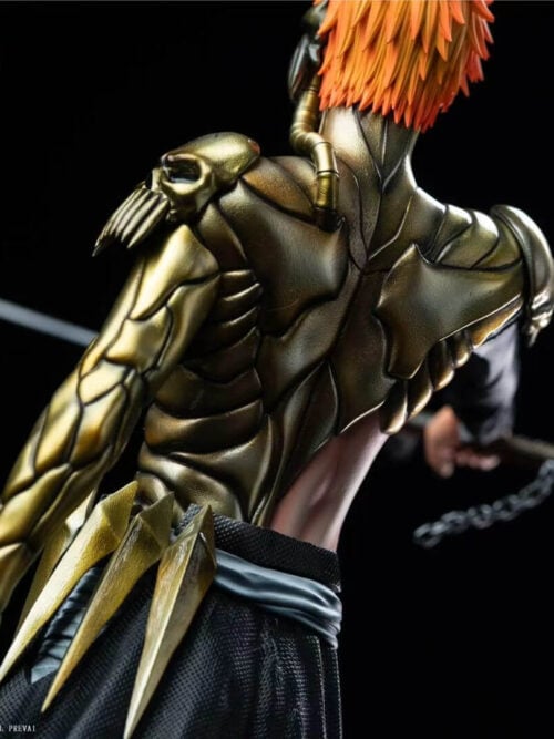Rear close-up of Ichigo's gold-toned back plates, skull shoulder detail and armored left arm beneath orange hair.
