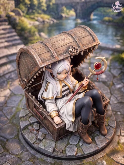 Elevated view of Frieren seated with raised knees inside a mimic chest, showing the staff, tooth-lined lid and stone base.