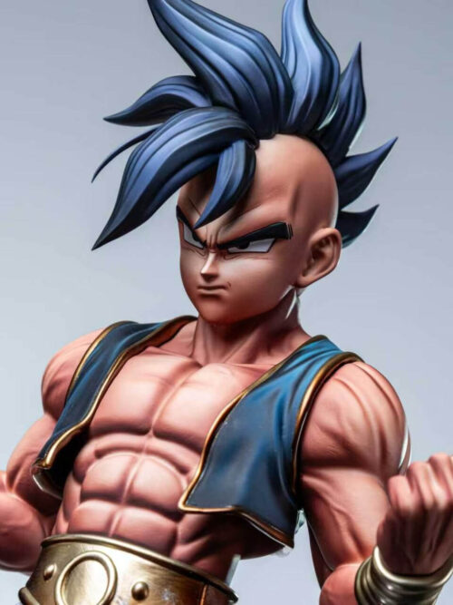 Close-up of Uub's closed-mouth expression, swept-up dark hair, blue vest and clenched fists.
