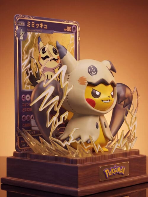 Three-quarter view of Mimikyu-costumed Pikachu showing hood stitching, dark claw-like forms, yellow lightning and the card-backed wooden base.