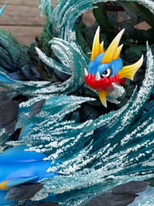 Carvanha framed by curling turquoise water, with parts of Sharpedo and Mega Sharpedo visible beside and below it.