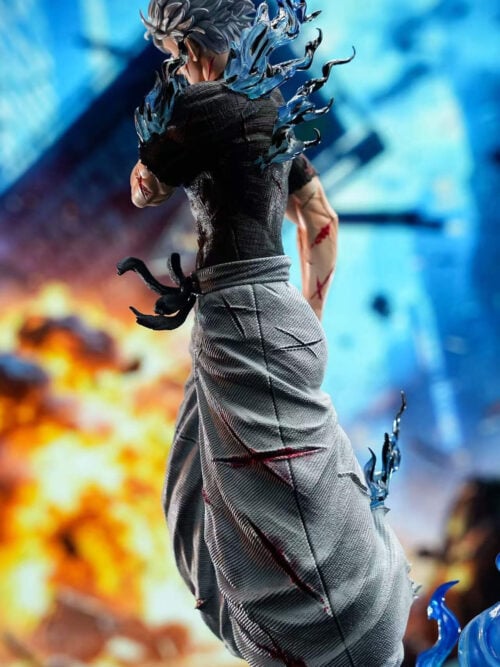 Rear view of Satoru Gojo showing blue effects around his shoulders, a textured black shirt and torn gray trousers.