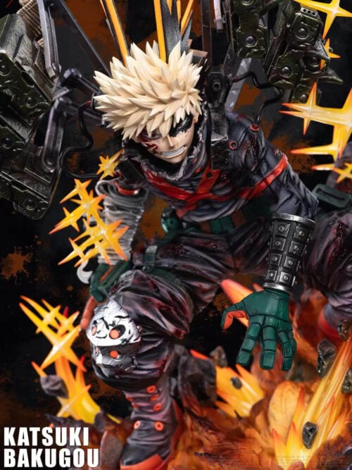 Close-up of Katsuki Bakugo with a damaged black eye mask, clenched teeth, an open green-gloved hand and yellow starburst effects.