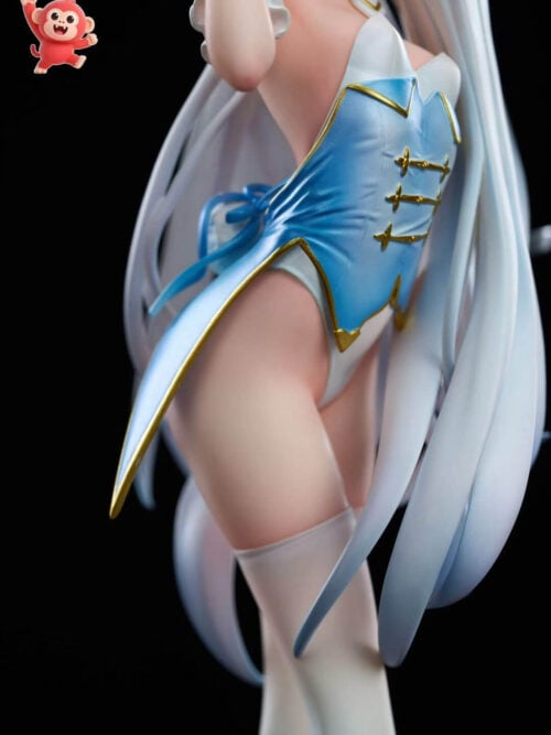 Detail of Melusine's blue-and-white costume with gold edging, three gold fastenings and sculpted fabric folds beside pale hair.