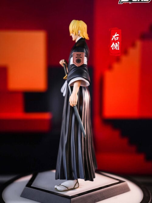 Side view of the D·ONE Studio Izuru Kira statue showing the Third Division lieutenant badge tied to his left sleeve and the sheathed sword at his hip.
