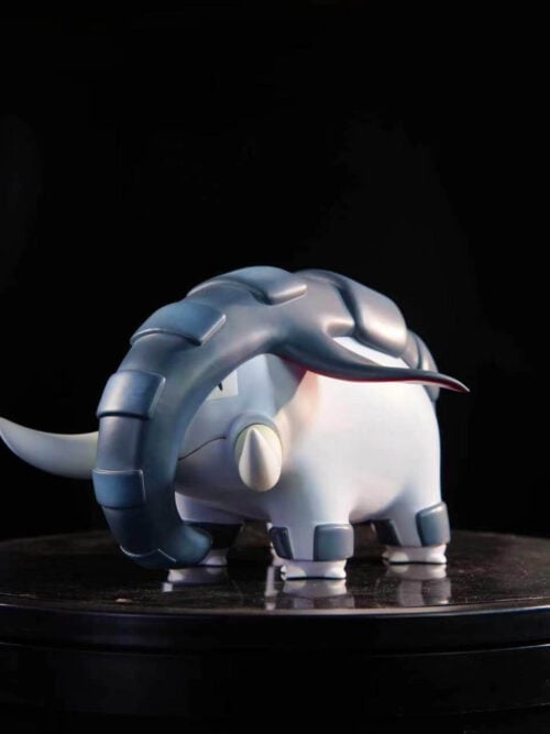 Three-quarter front view of LD Studio Donphan resin figure on a black turntable, highlighting its pale gray body, curved tusks, and dark leg bands.