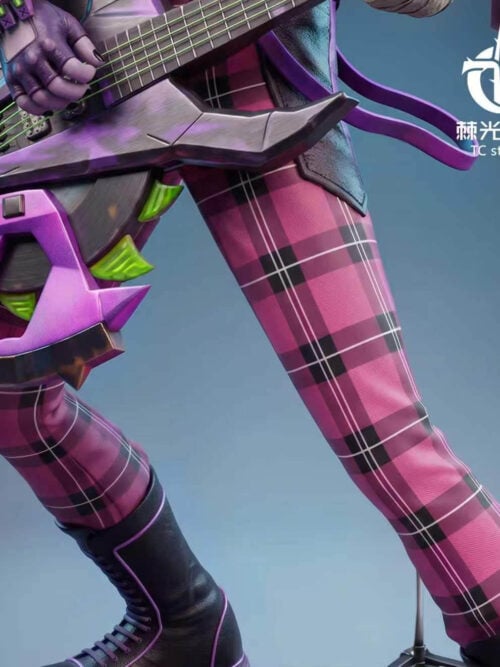 Close-up of the Hemlock statue's pink-and-black plaid trousers and the lower edge of the bass guitar fitted with a green-toothed circular sawblade.