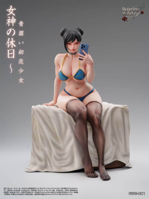 Front studio render of the seated Chun-Li statue on a cloth-covered platform, holding a phone against a gray background.