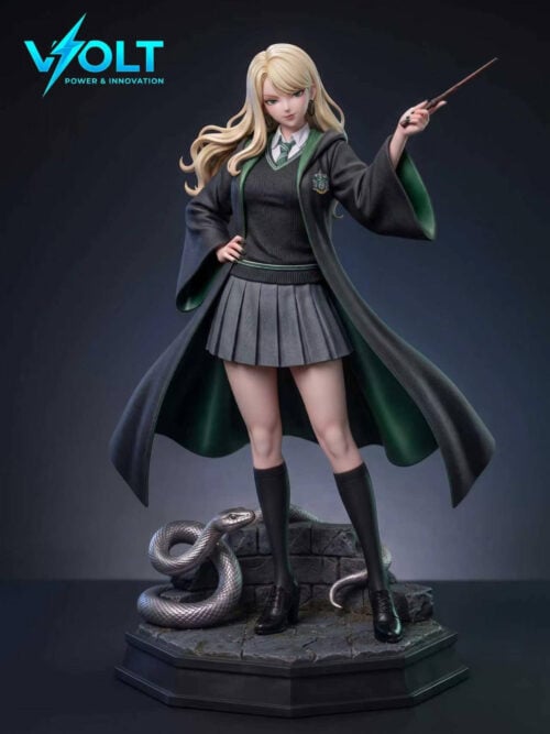 Studio view of the standing blonde figure in the normal outfit: open dark robe with green lining, gray sweater, striped tie, pleated skirt, knee-high socks, and black shoes. One hand rests at the hip and the other raises a wand. A silver snake coils on a stone base with a dark octagonal plinth.
