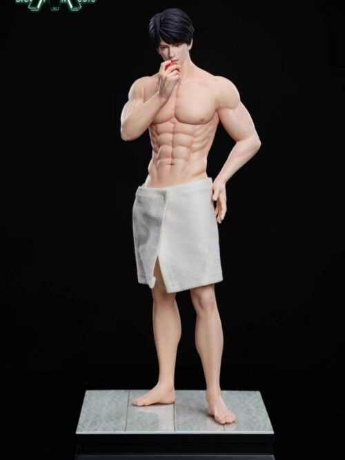 Front view of a shirtless Caleb statue with black hair, a white bath towel at the waist, and a red apple held to his mouth. He stands barefoot on a gray tiled display base against a black background.