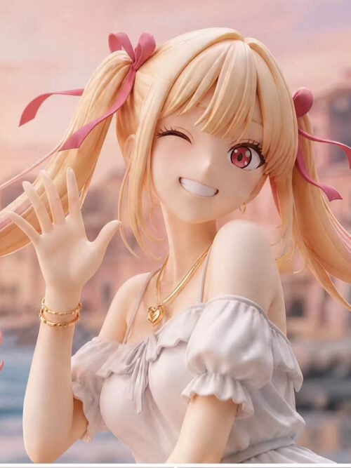 Close-up upper-body view of Nico Studio's 1/6 scale Marin Kitagawa Holiday Ver. statue winking and smiling while waving her right hand, showing her pink ribbon hair bows, gold heart necklace, gold bracelets, and white ruffled bodice.