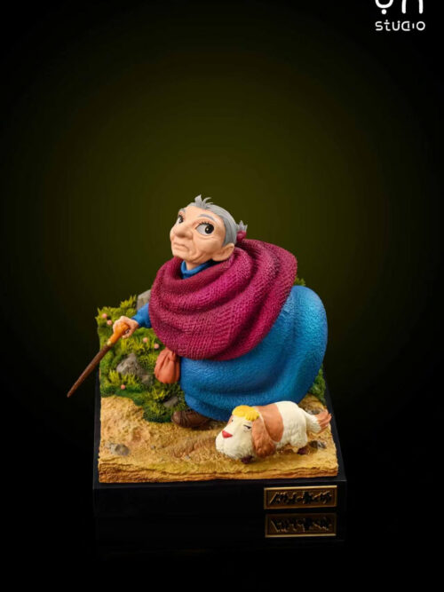 Front three-quarter studio view of elderly Sophie looking upward in a magenta shawl and blue dress with Heen on a sloped path base.