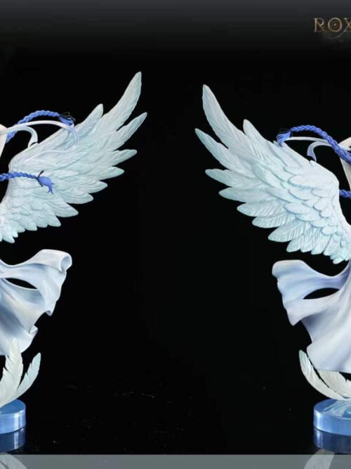 Front and rear full-body comparison of the 1/6 Roxy Migurdia - Angel statue against a black background, showing the wing feather sculpting, open-backed white drapery, and circular blue water base.