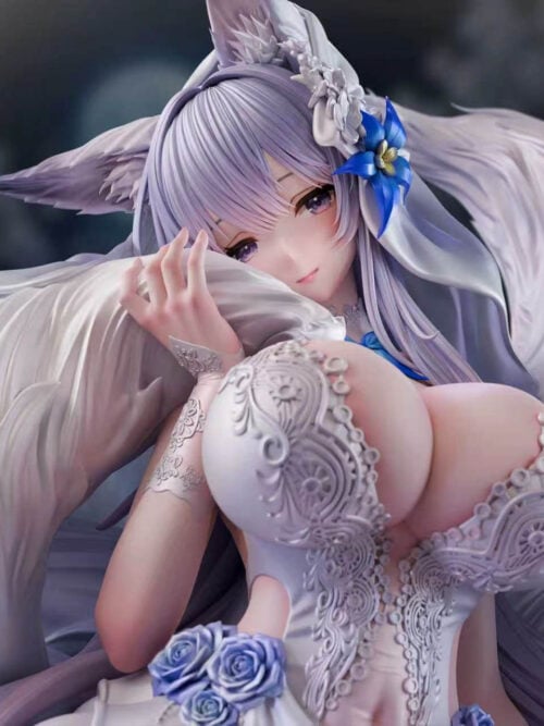 Upper-body close-up of the Shinano 1/6 figure by Hyperion Studio, showing her purple eyes, fox ears under a floral-trimmed white veil, right hand resting against a white tail tip, and raised lace relief on her bridal bodice.