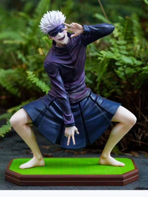 Full-body front view of Firefly Studio's Satoru Gojo Vol. 02 1/6 scale statue crouching barefoot on its brown-trimmed green tatami-style base with double peace signs against a fern background.