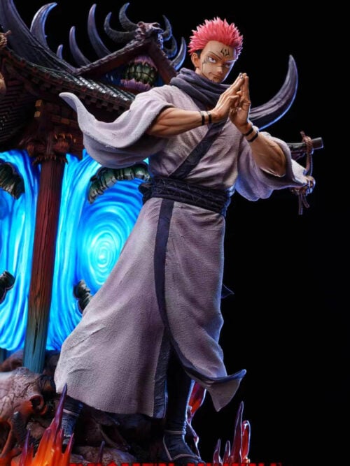 Three-quarter right view of the RealWorld Studio 1/6 Ryomen Sukuna statue standing in a textured kimono atop the flame-ringed skull base in front of the illuminated blue shrine vortex.