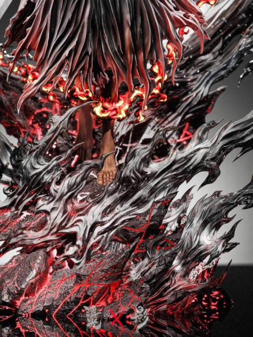 Close-up of the display base of the Ichigo Kurosaki statue showing his bare feet below tattered black robes and red flames atop swirling black-and-white waves and a red-veined rock base.