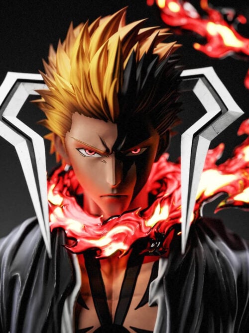 Close-up of the Ichigo Kurosaki statue portrait with split orange-and-black spiky hair, red eyes, angular white horn structures flanking the head, and red-and-yellow flame effects around the neck.