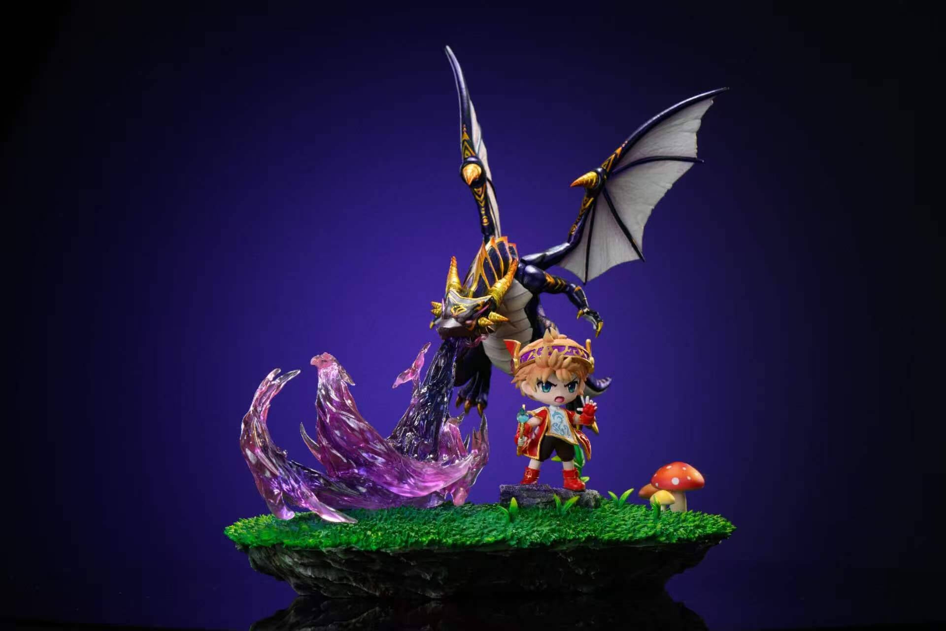 Evan & Mir - MapleStory Full Diorama Front View Front view of Time Studio's Evan & Mir statue from MapleStory showing chibi Evan with his staff on a rocky outcrop and the dragon Mir hovering above a grassy mushroom base with translucent purple flames.