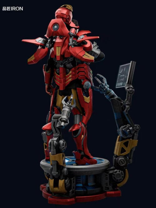Full rear three-quarter view of the IRON Studio Iron Man MQ70 Mark VII 1/3 statue showing the open back and helmet armor, red-and-gold leg plating, circular base, and two articulated gantry arms.